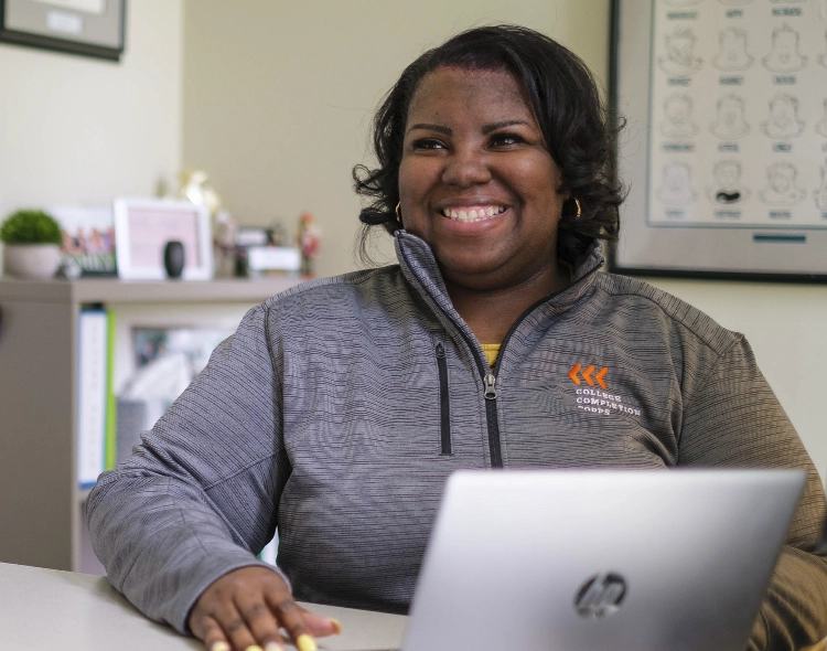A woman working on a laptop